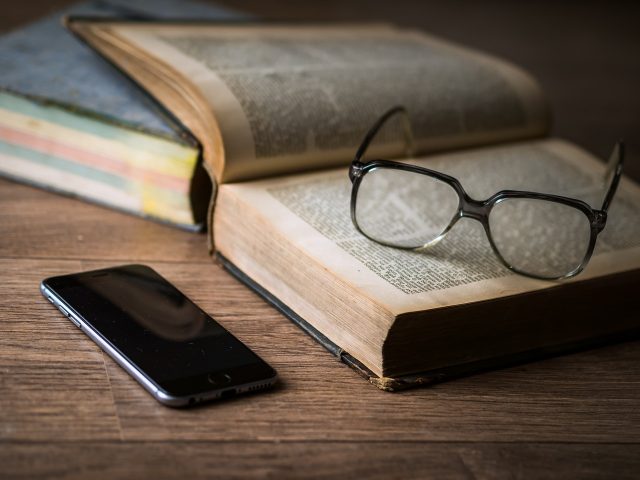mobile phone, glasses & law books